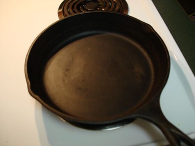 How do you cure a cast iron skillet?