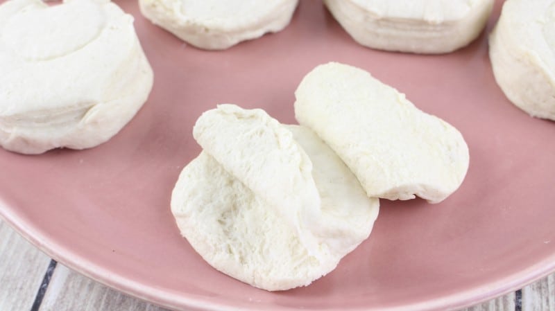 Tearing biscuit into three layers.