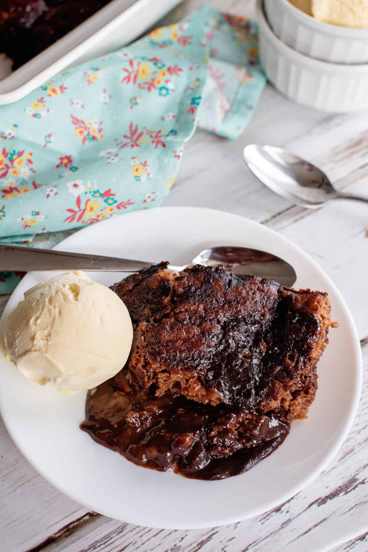 Bowl of chocolate cobbler with ice cream.