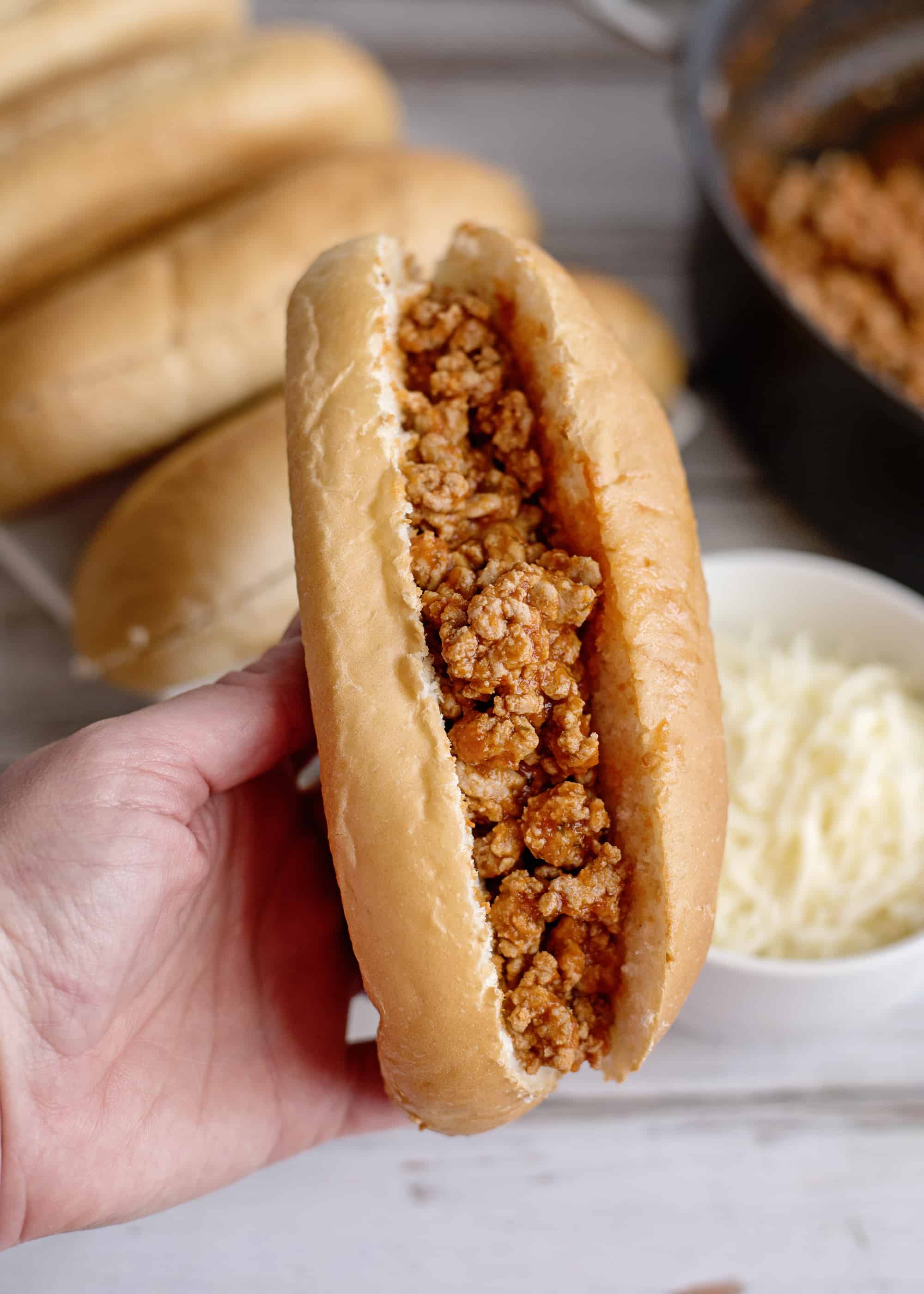 Fill sliced rolls with beef mixture.