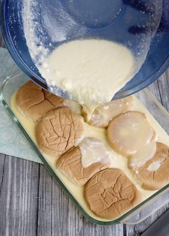 Pour sauce over buns in baking dish.