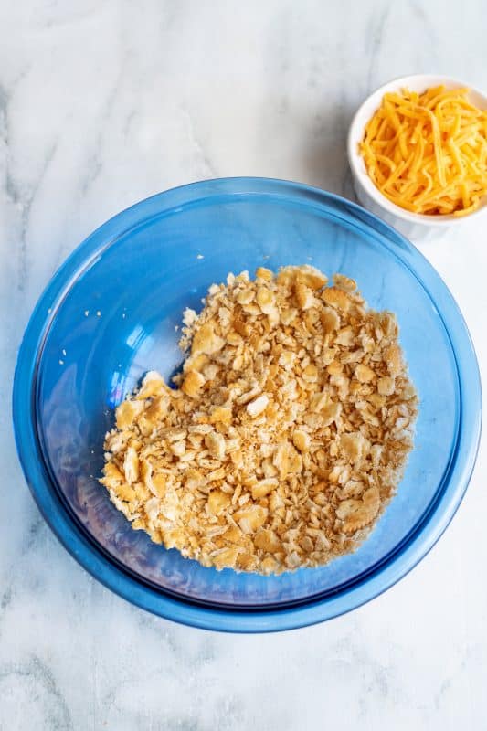 Crush Ritz crackers in a bowl.