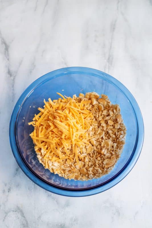 Add cheese to mixing bowl and stir.