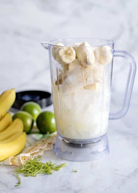 Add sugar or honey, milk, and lime juice to blender.