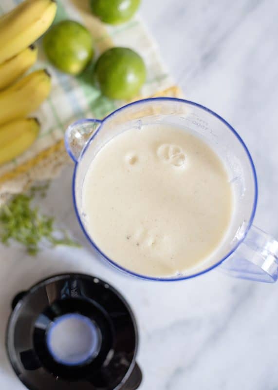 Blended banana smoothie with milk.