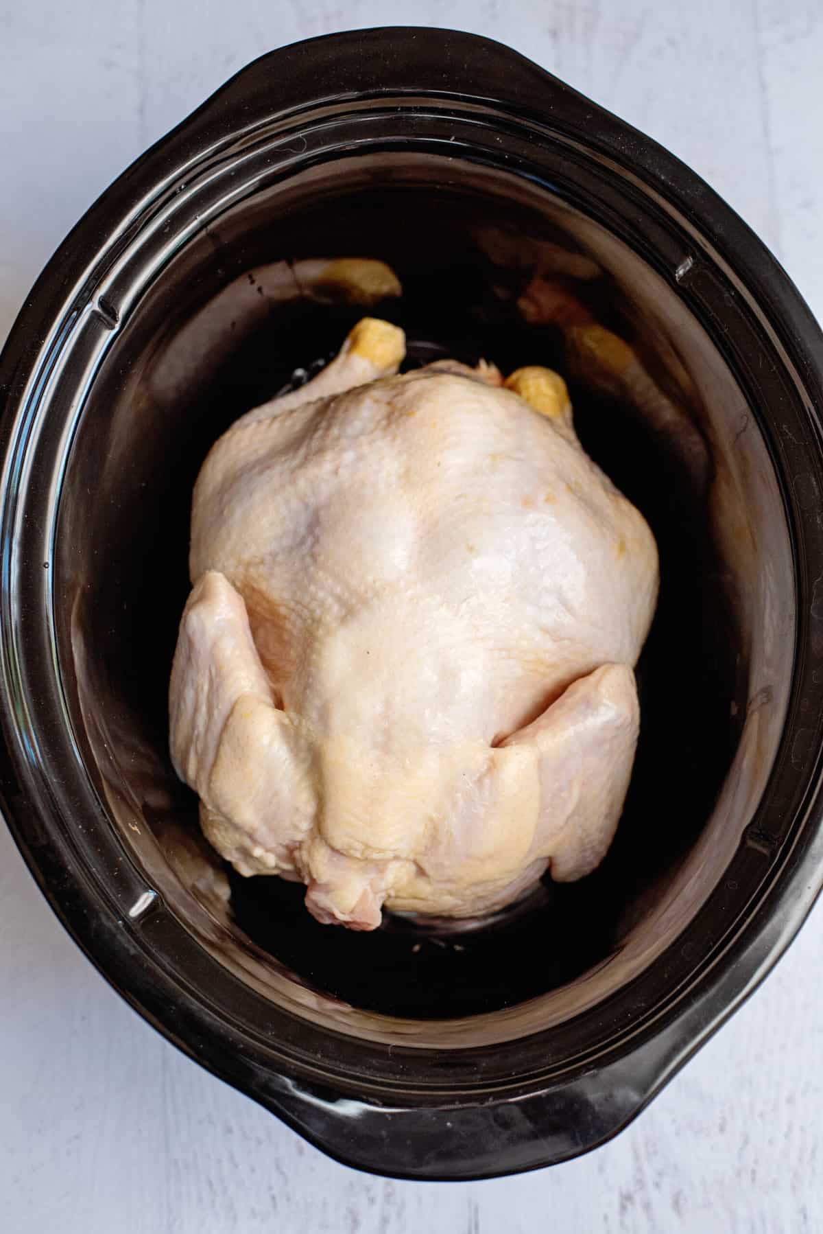 put the chicken in a crock pot