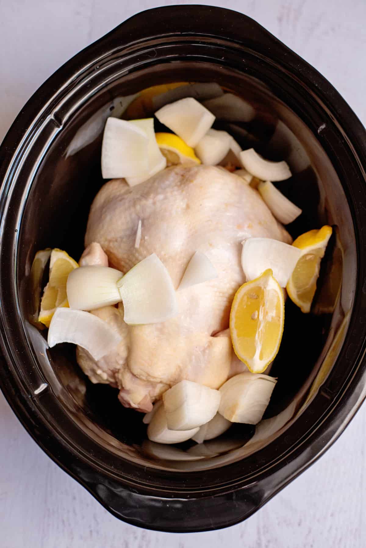 add lemon and onion to chicken