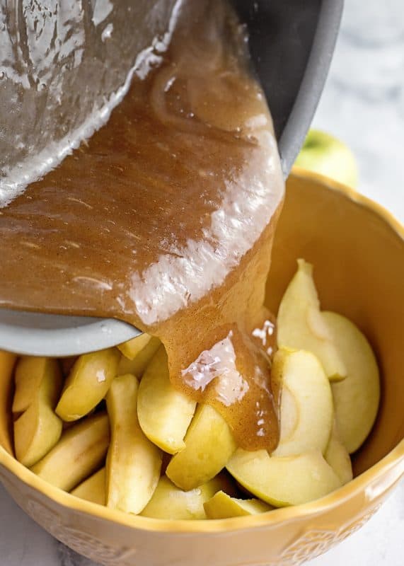 Pour sauce over fried apple slices.