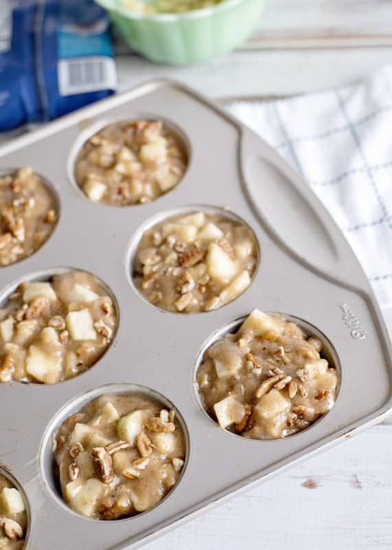 Add apple spice muffins batter to muffin tin and bake.