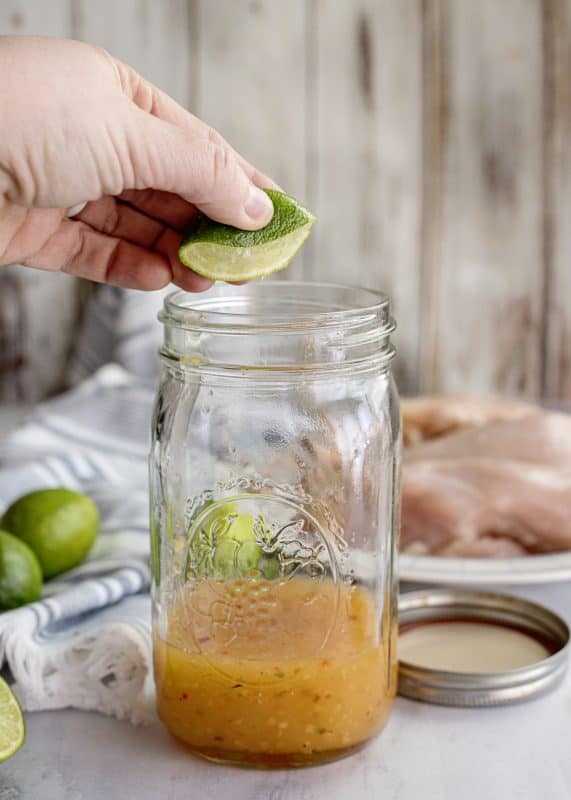 adding lime juice to marinade