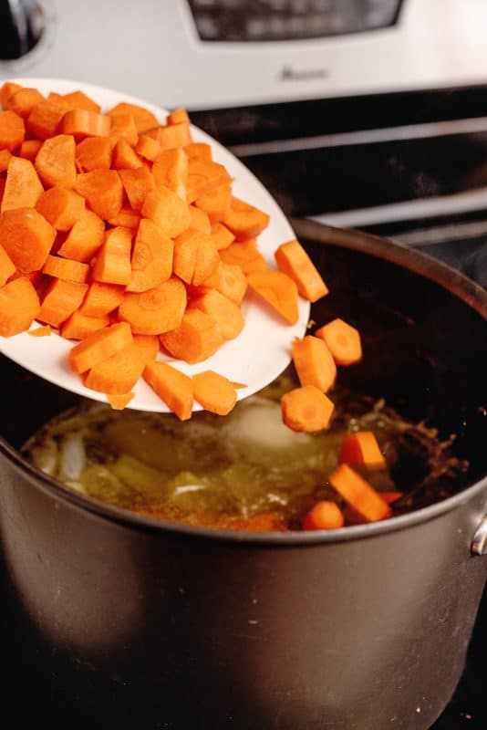 peel and chop up carrots and add to broth