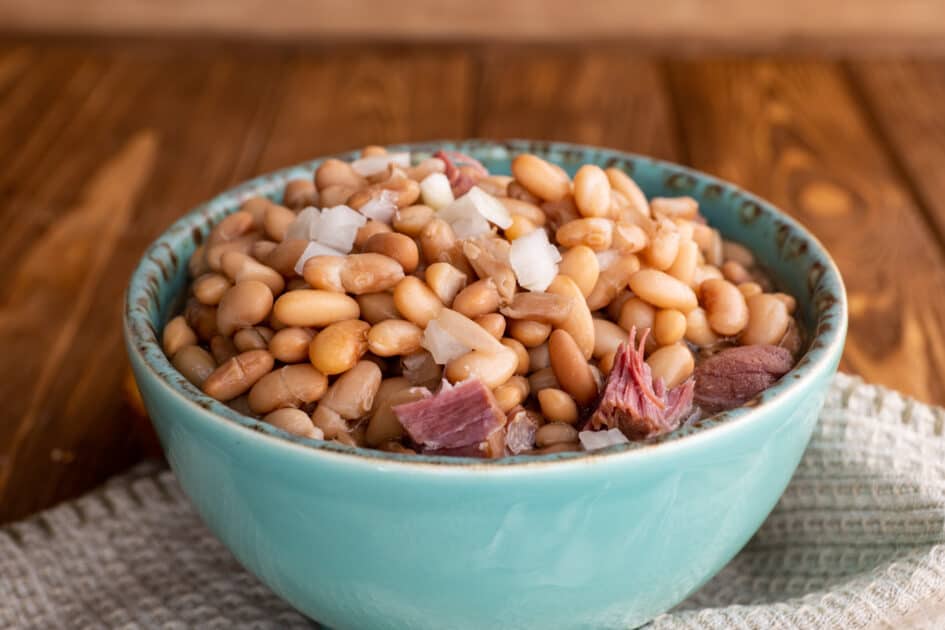 Bowl of pinto beans and ham.