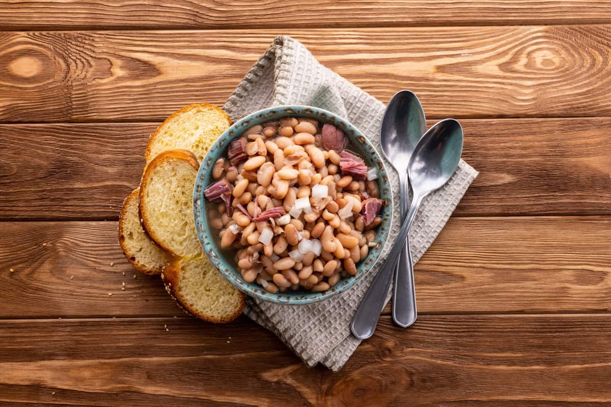 Bowl of pinto beans and ham.