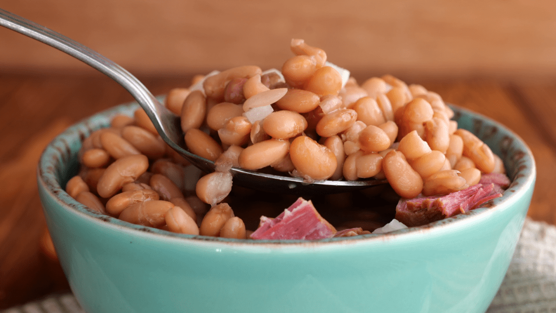 Spoonful of pinto beans and ham.
