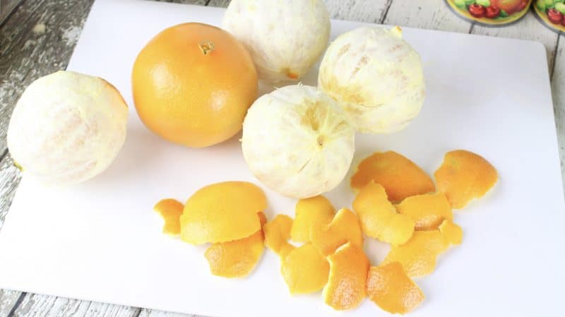 Peel and slice oranges.