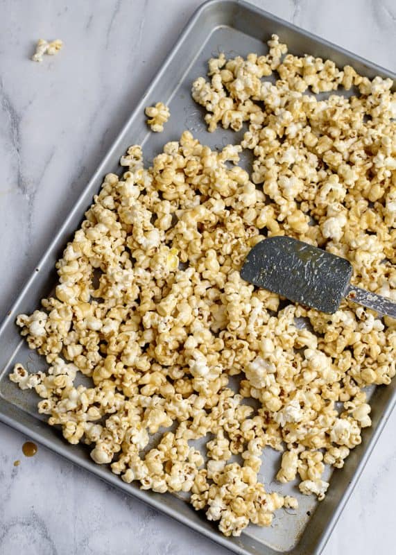 Caramel corn on baking sheet.