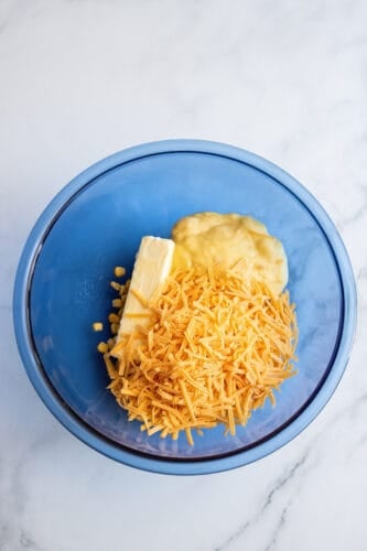 Cheese added to mixing bowl.