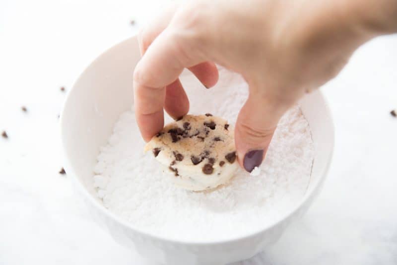 Dip cookie into sugar.