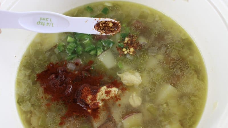 Add seasonings and jalapeno to stockpot.