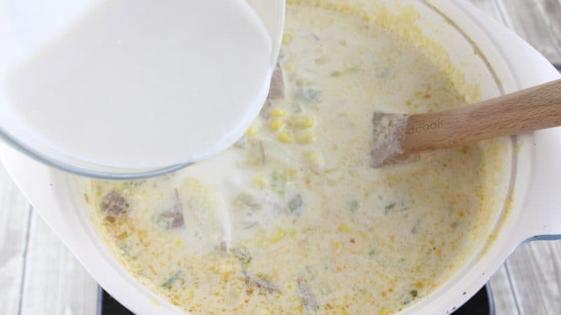 Add flour/milk mixture to potato corn chowder after 15 minutes.