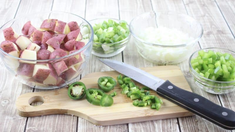 Chop up vegetables for your potato corn chowder.