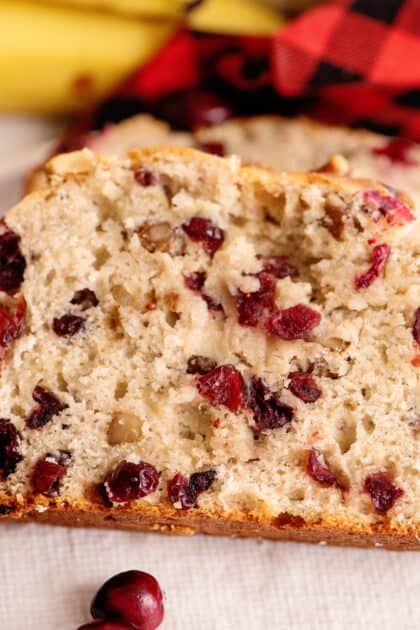 Close-up of a slice of cranberry banana bread.