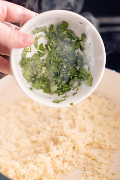 Add cilantro to skillet.