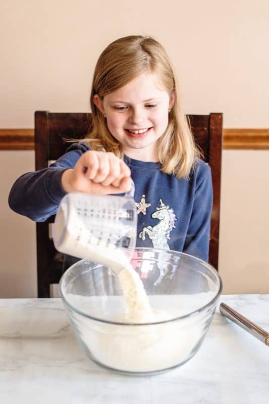 Add powdered milk to mixing bowl.