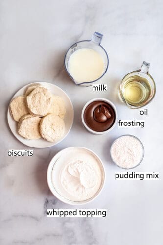 Flat-lay of ingredients used to make mini Boston cream pies, with written description.