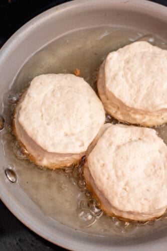 Biscuits cooking in oil.