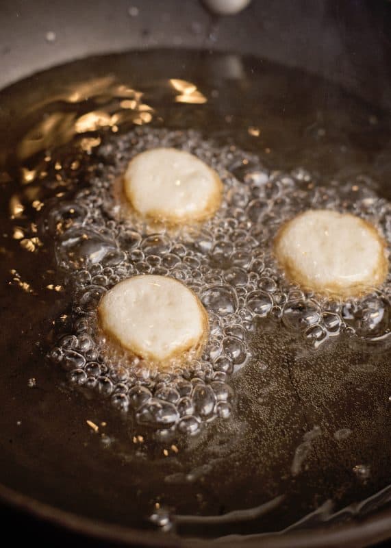 doughnut holes frying in oil