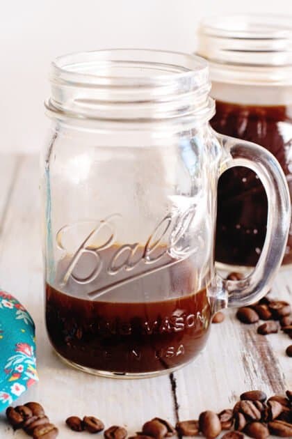 Four ounces of cold brew coffee concentrate in a glass.