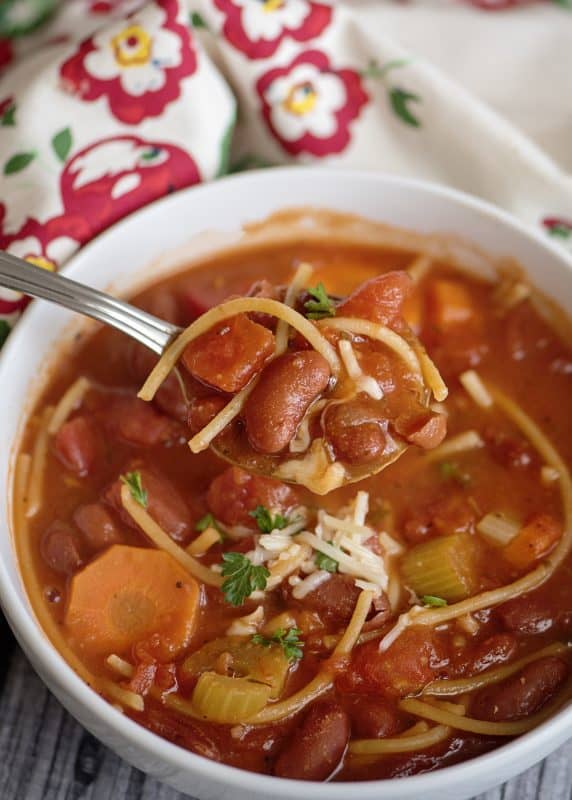 Taking a bite of spaghetti soup.