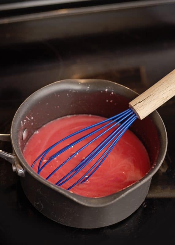 Stir ingredients in saucepot over heat.