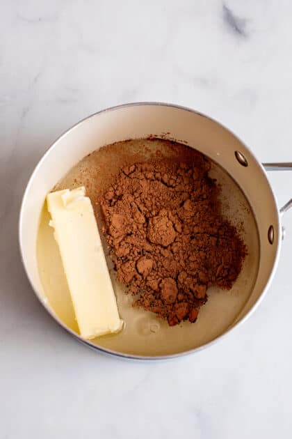 Bring butter, oil, cocoa, and one cup of water to a boil.