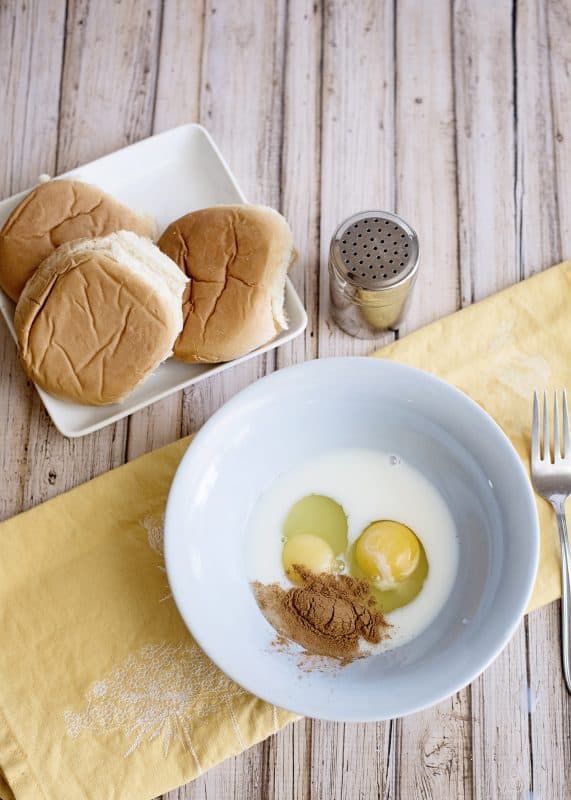 Place eggs, milk, and cinnamon in a mixing bowl.