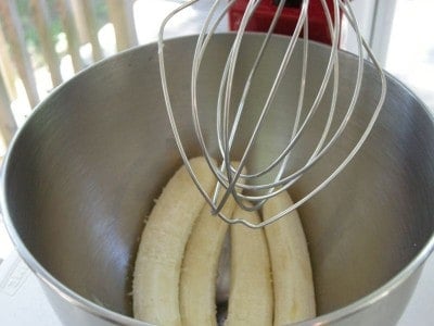 Add peeled bananas to mixing bowl.