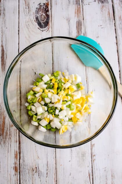 Add chopped ingredients to a mixing bowl.