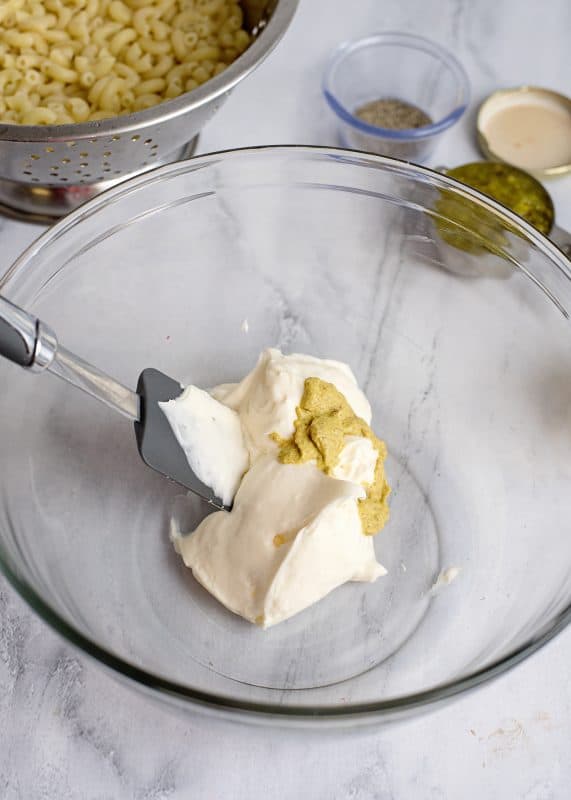 Mayo and mustard in mixing bowl.