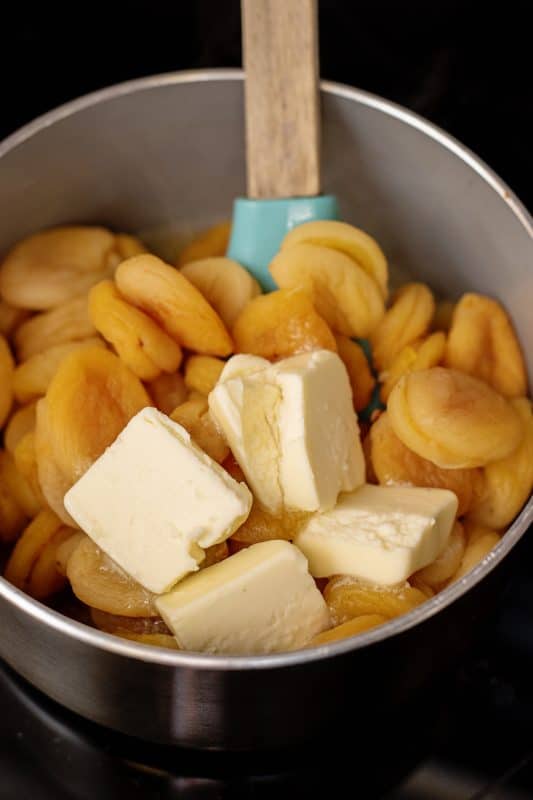 Add butter to saucepot with dried fruit.