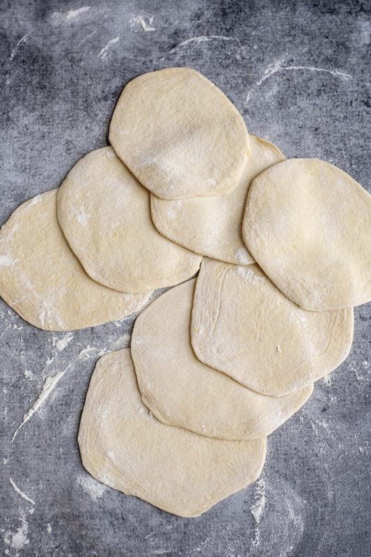 Biscuit dough rolled out to 6-inch circles.