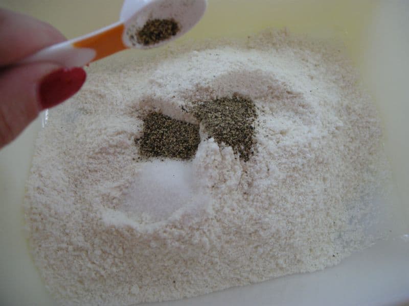 salt, pepper and cornmeal in bowl.