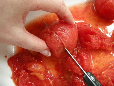 Carefully chop up tomatoes.