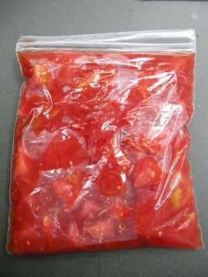 Freezer bag filled with tomatoes.