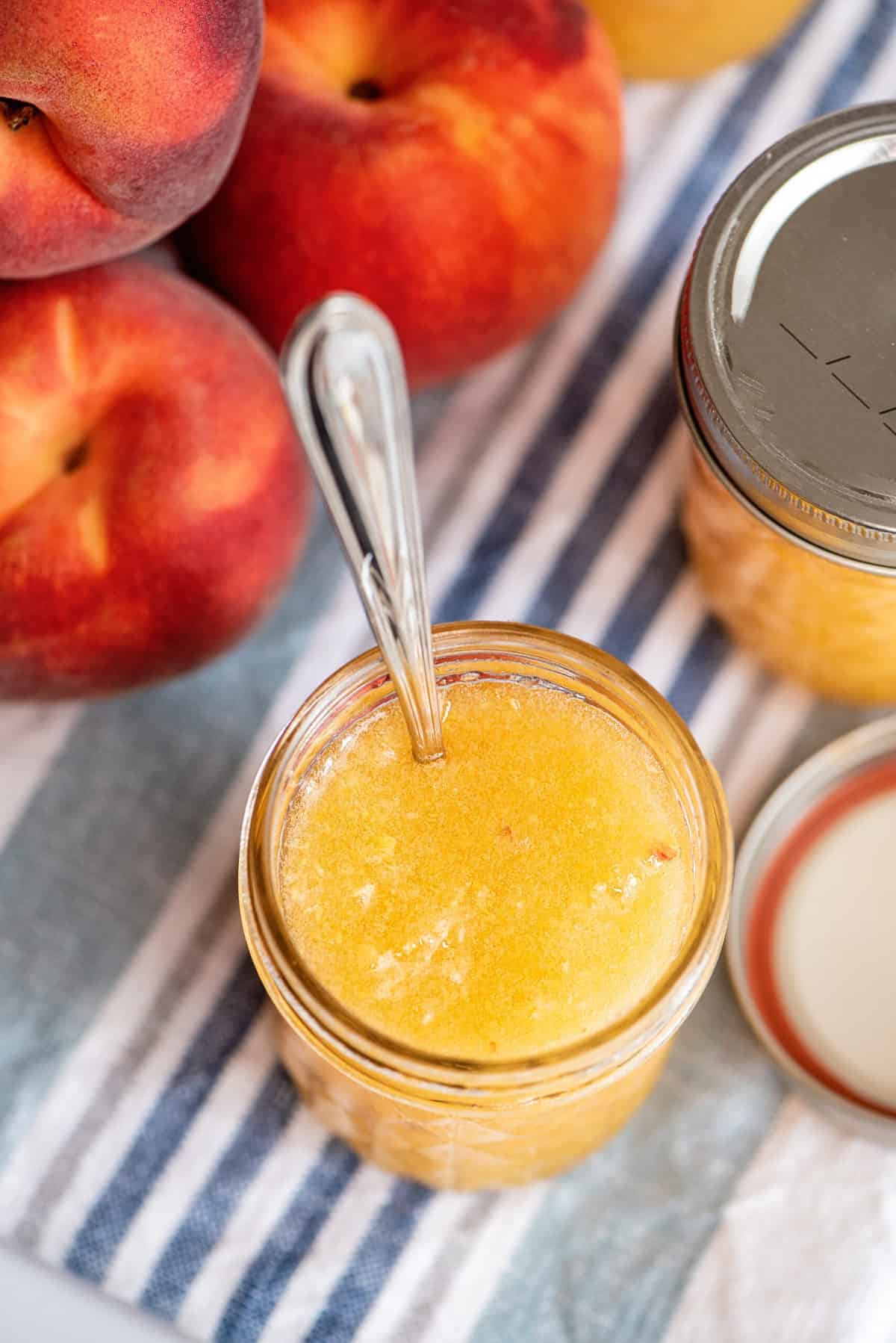 Peach freezer jam in jar.
