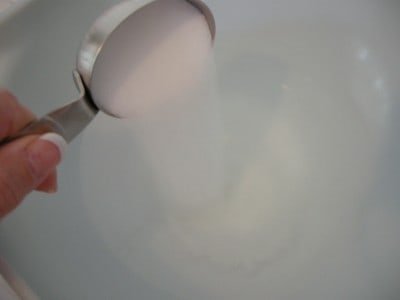 Combine warm water and salt in bowl.