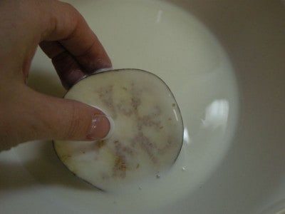 Dip each eggplant slice in the buttermilk.