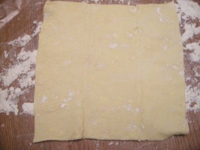 Unfold puff pastry sheet onto a floured surface.