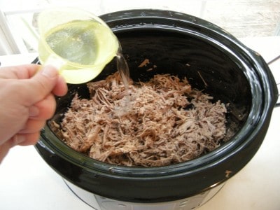 Add water and shredded beef to crockpot.
