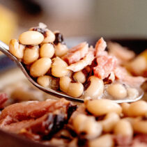Spoonful of black eyed peas and ham
